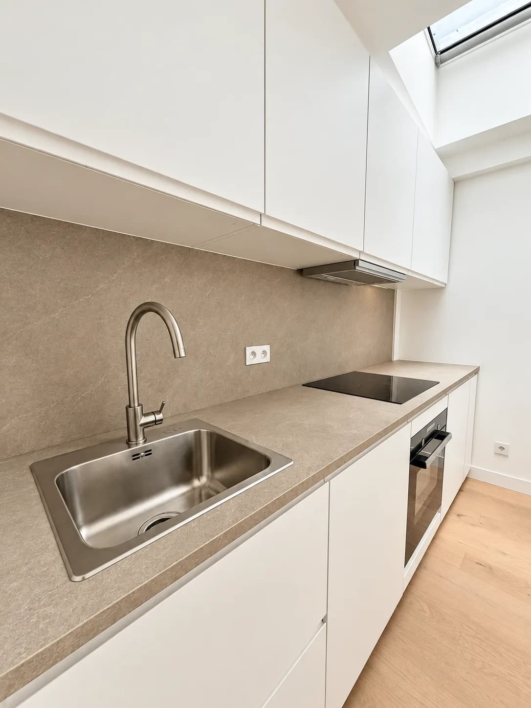 Kitchen: stainless steel sink and worktop